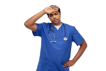 healthcare, profession and medicine concept - stressed indian doctor or male nurse in blue uniform over white background
