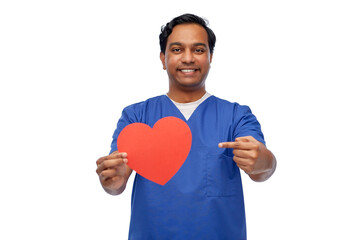 healthcare, profession and medicine concept - happy smiling indian doctor or male nurse in blue uniform with red heart over white background