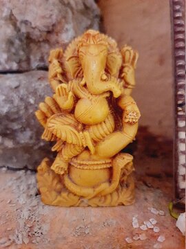 Brown wooden craft ganesh ji idol statue. 