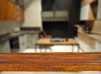 Wooden board on kitchen interior background. Furniture store. Sharpness on the board. Place for product advertising. Free space for design and goods. Layout for products.