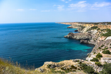 Cape Fiolent in Balaklava, Russia. View from the top of the cliff. azure sea, sunny day against a clear sky.