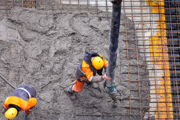 Concrete pouring on the construction site.