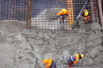 Concrete pouring on the construction site.