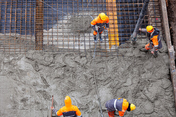 Concrete pouring on the construction site.