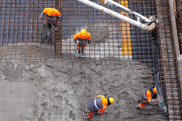 Concrete pouring on the construction site.