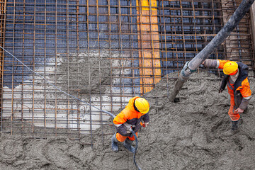 Concrete pouring on the construction site.