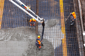 Concrete pouring on the construction site.