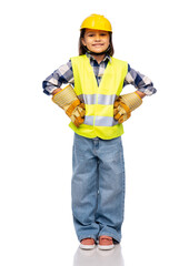 building, construction and profession concept - smiling little girl in protective helmet, gloves and safety vest over white background