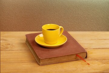 Home office workspace with coffee cup, and book