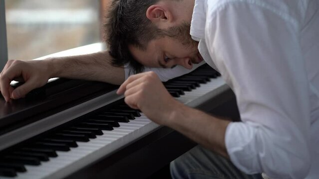The pianist is a composer who has been abandoned by his muse in depression and plays the piano and cannot find inspiration.