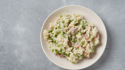 Classic italian risotto with peas, cheese parmesan, prosciutto. Risi e Bisi (Venetian-style rice and peas)