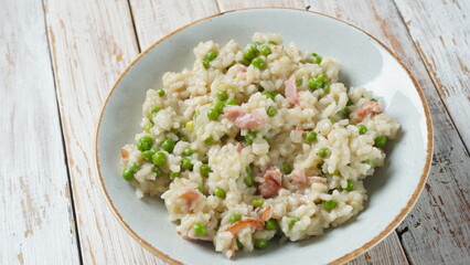Classic italian risotto with peas, cheese parmesan, prosciutto. Risi e Bisi (Venetian-style rice and peas)