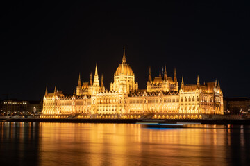 Fototapeta premium Hungarian parliament building from across the Danube river at night Budapest Hungary Europe