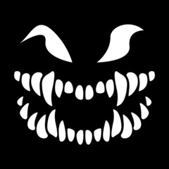 Fototapeta premium Halloween. The face of the monster on a black background. Skeleton with sharp teeth