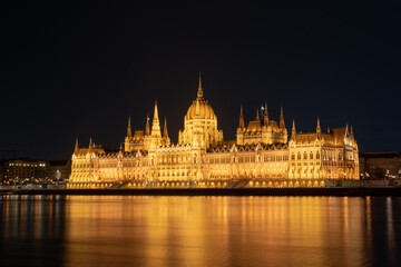 Fototapeta premium Hungarian parliament building from across the Danube river at night Budapest Hungary Europe