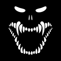 Fototapeta premium Halloween. The face of the monster on a black background. Skeleton with sharp teeth