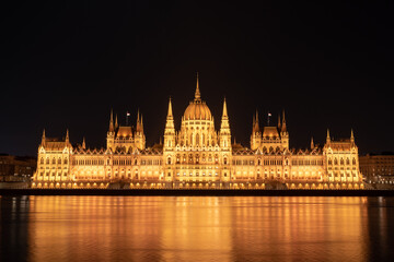 Fototapeta na wymiar Hungarian parliament building from across the Danube river at night Budapest Hungary Europe