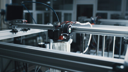Modern 3D printer printing model from plastic in workshop of professional design studio - obrazy, fototapety, plakaty