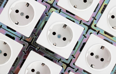Background from home electric sockets, close-up. The concept of tariffs and prices for electricity