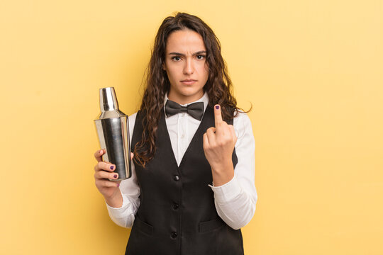 young pretty hispanic woman feeling angry, annoyed, rebellious and aggressive. bartender and cocktail concept