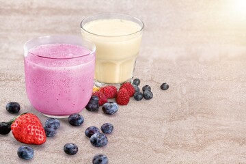 Tasty milkshake with blueberries in a glass on  background. Healthy dessert