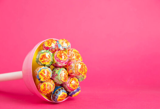 BOBRUISK, BELARUS 22.01.22: A large candy brand chupa chups consisting of small candies on a pink background, close-up. Copy space for text
