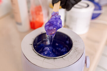 close-up. melted lilac wax for depilation and epilation