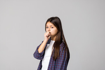 Fototapeta na wymiar Young girl coughing isolated on gray background