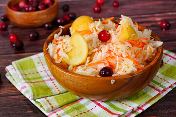 Sauerkraut with apples and cranberries. Traditional Russian food - 484172720