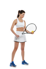 Obraz na płótnie Canvas Portrait of young beautiful girl, tennis player in white sportswear posing with racket isolated on white background. Beauty, sport concept.