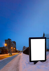 Clear billboard at night street with a blank screen for copy advertising or promotional poster, an empty lightbox mockup for information, an empty display  with nightlight