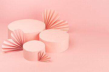 Gentle pastel pink abstract stage mockup with group of three round podiums, fly paper hearts of fans in chinese style, copy space, top view. Scene template for advertising, presentation cosmetic.