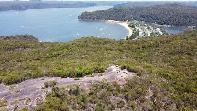 Aerial drone shot of Elephant Rock tourism rock formation Brisbane Water National Park bushland Central Coast NSW Australia 4K
