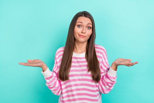 Portrait of attractive indifferent unsure girly girl shrugging shoulders isolated over bright teal turquoise color background