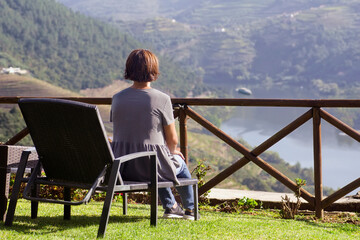 woman looking Douro valley  in Portugal , Europe , world heritage site , focus in foreground