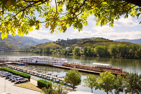 cruise ships with tourists on river  in  Vale do Douro  in Portugal , Europe , world heritage site