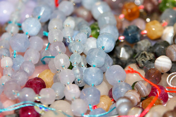 Composition of jewelry making supplies, colorful shiny mixed beads,  close up. Selective focus.