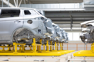 Photo of automobile production line. Welding car body. Modern car assembly plant. Auto industry....