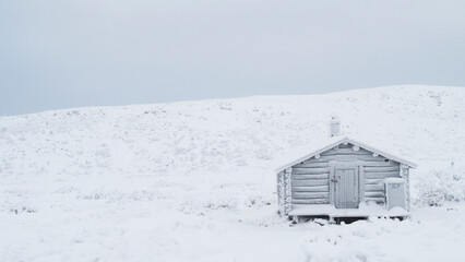 old cabin in the snow