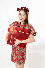 Chinese New Year concept, Woman holding red present gift box to give in Chinese New Year Celebration