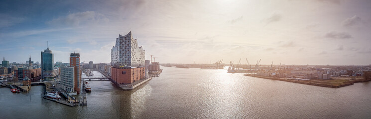 Panorama of a sunrise in Hamburg harbour with concert hall