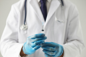 Professional medical doctor in hospital office. Portrait of young and confident physician. Medical...