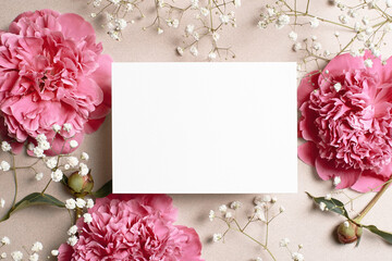 Wedding invitation card mockup with pink peony and gypsophila flowers