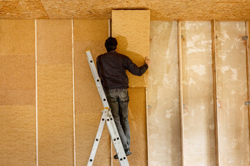 Installing thermal insulation inside a building, wood fiber boards  - 484192119