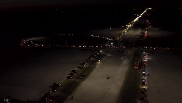 Aerial view of Freedom Convoy 2022 as they pass through Manitoba Canada.  Thousands of people lined up in support of this protest.