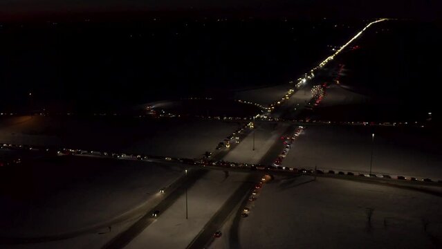 Aerial view of Freedom Convoy 2022 as they pass through Manitoba Canada.  Thousands of people lined up in support of this protest.