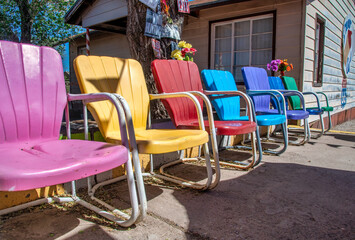 SELIGMAN, AZ - JUNE 29, 2018: Colorful chairs along a city road.