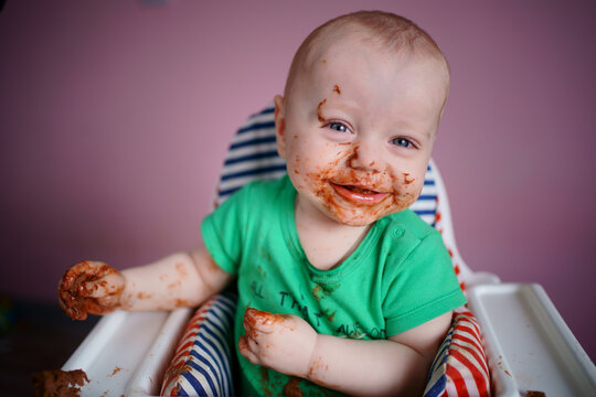 baby stained in chocolate. High quality photo