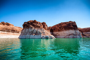 Cruise along Lake Powell. View of narrow, cliff-lined canyon from a boat in Glen Canyon National Recreation Area, Arizona..