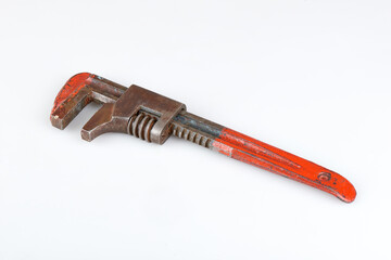 Old and rusty adjustable wrench. Studio shot